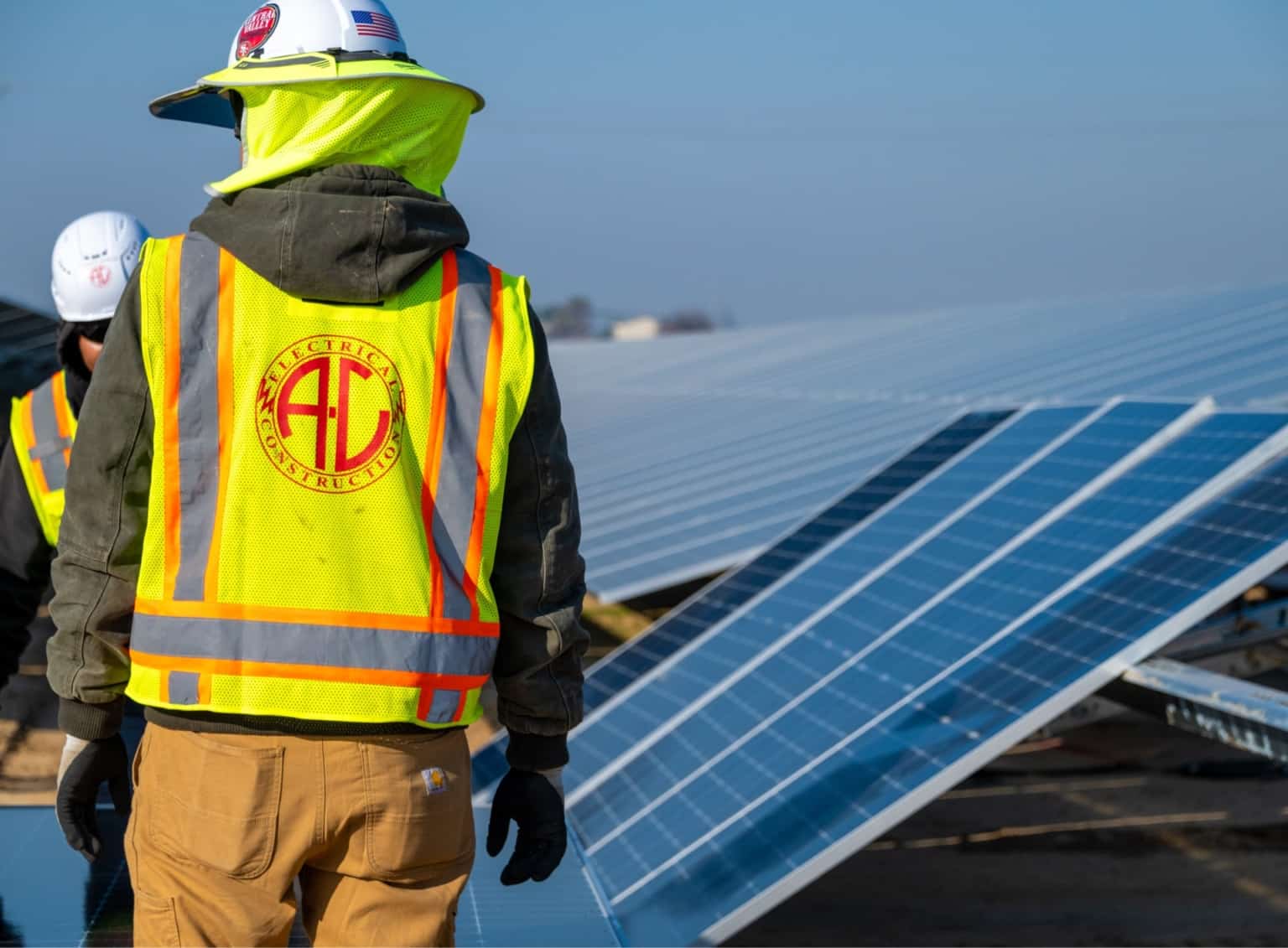 home about A-C Electric Company laborers installing solar panels